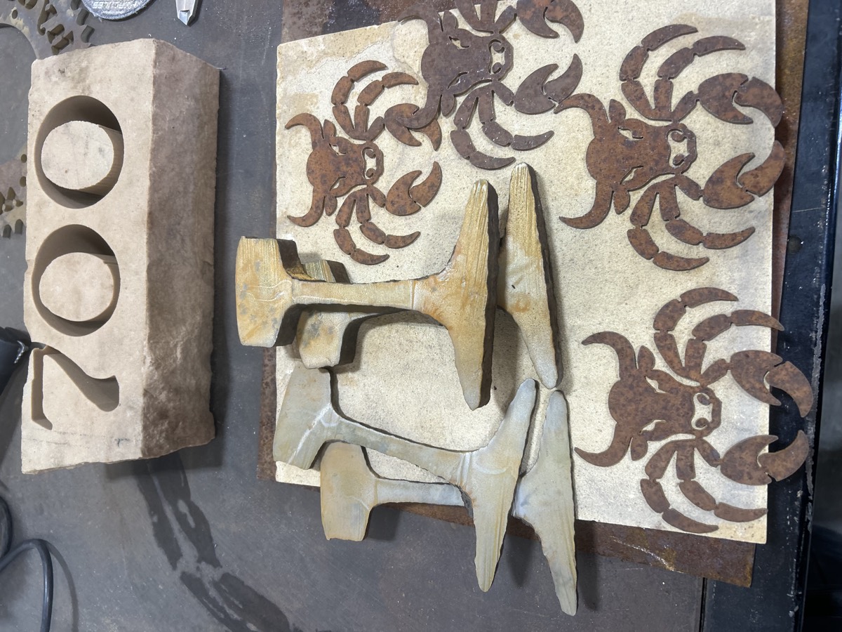 Sandstone address stone and bull-head art cut in steel